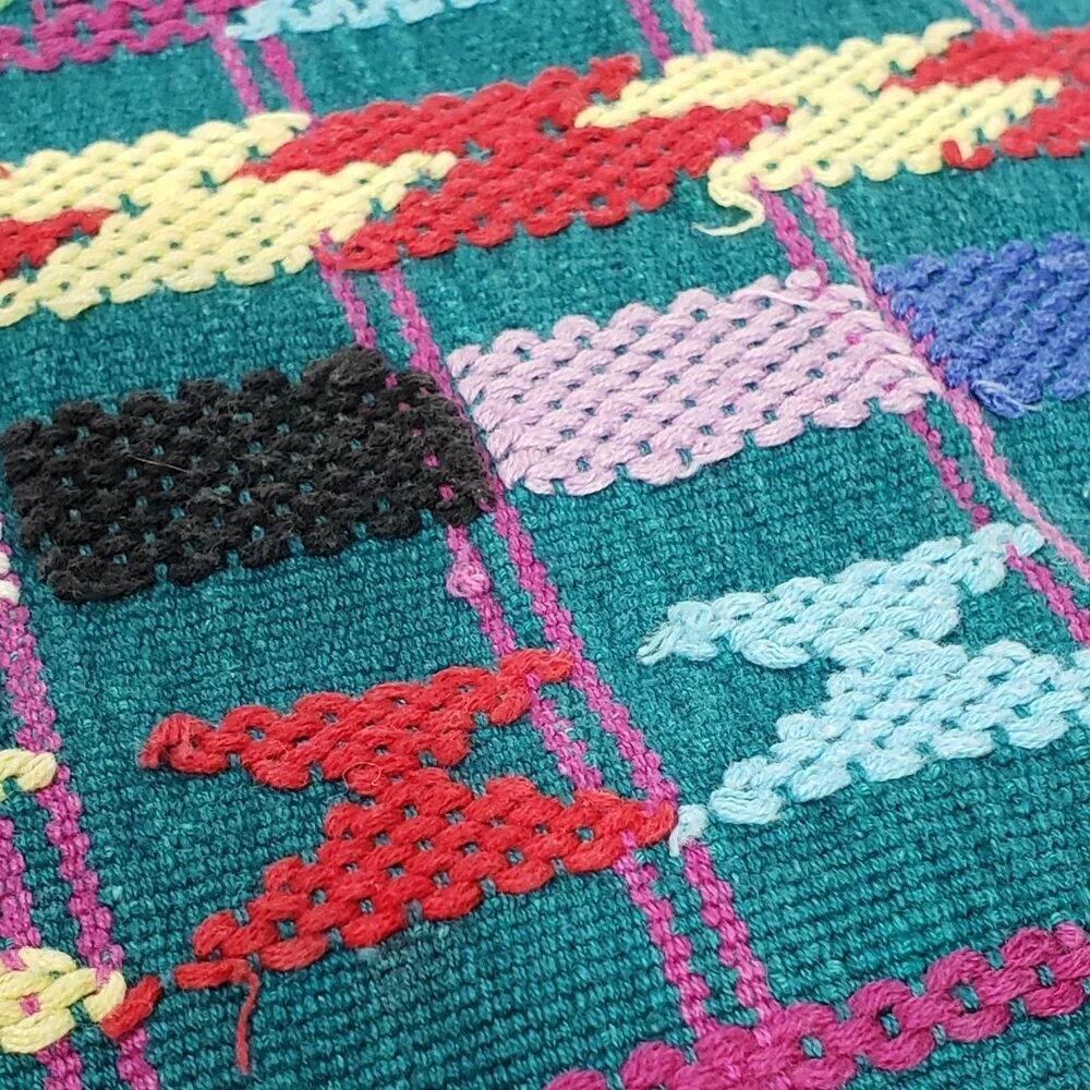 Handwoven Colorful Table Runner Teal background with lots of other colors